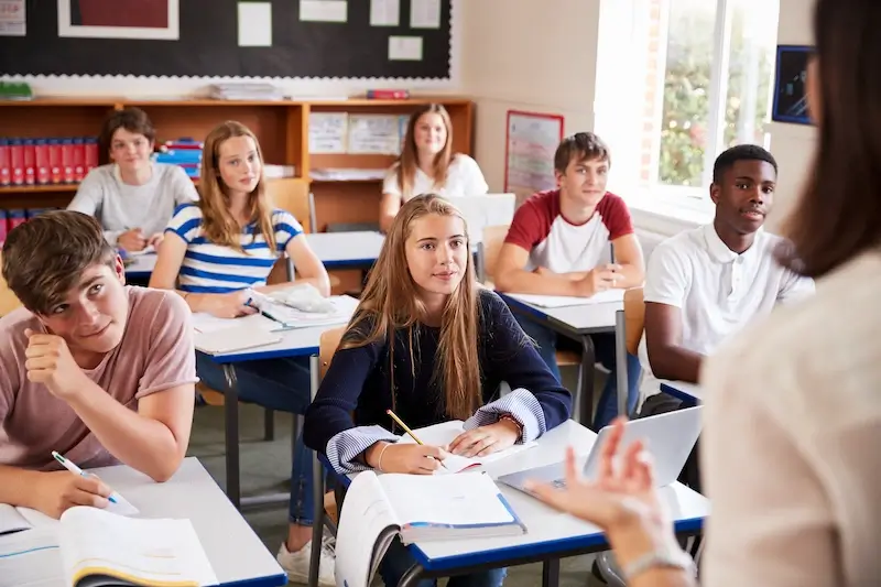 Students listening to female teacher in classroom 2024 10 19 13 33 31 utc